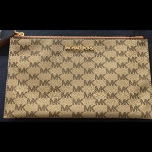 Nwnt MK wristlet. Compartments for your credit cards. Fits most phones.